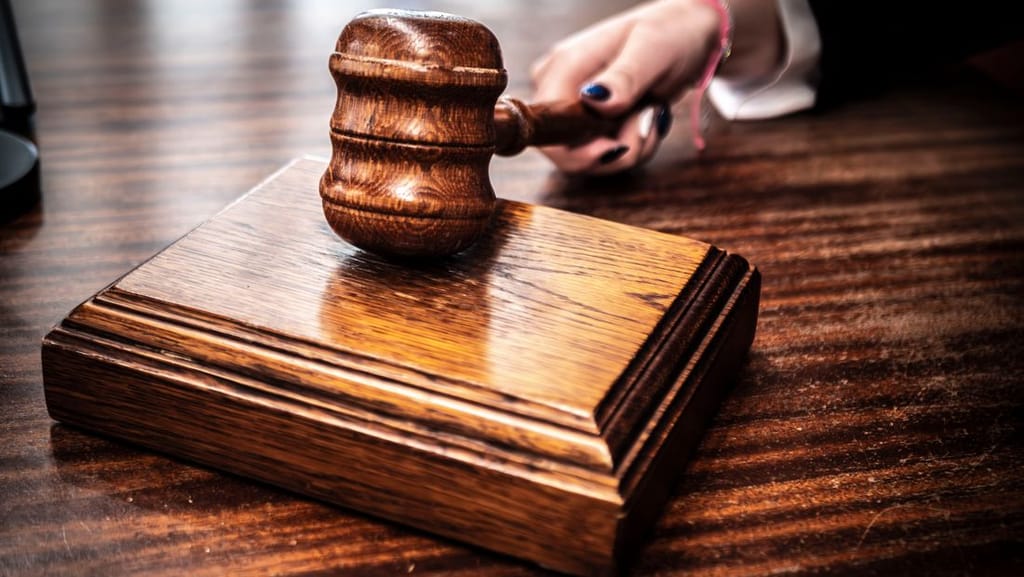 A wooden judge's gavel, representing special education laws and the rules that govern disability services