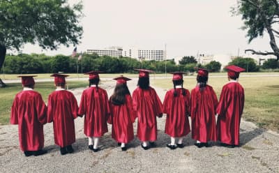 New Life Christian Academy graduates standing together outdoors