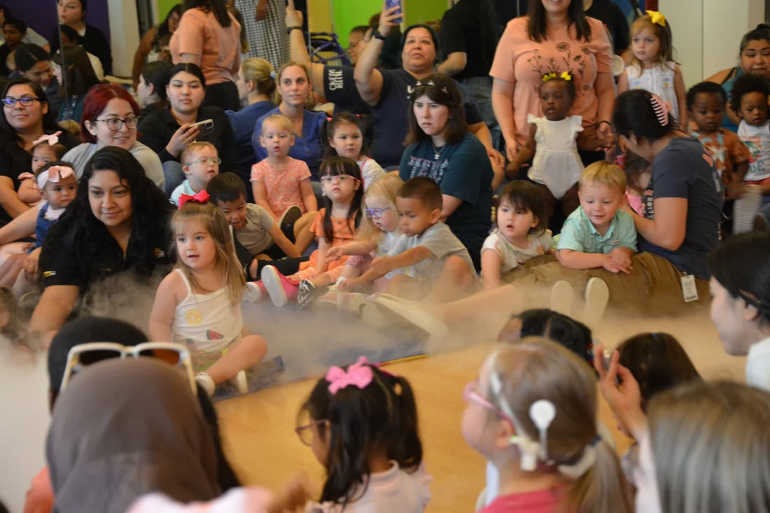 Children and families gather for a sensory activity at Rise School of Houston