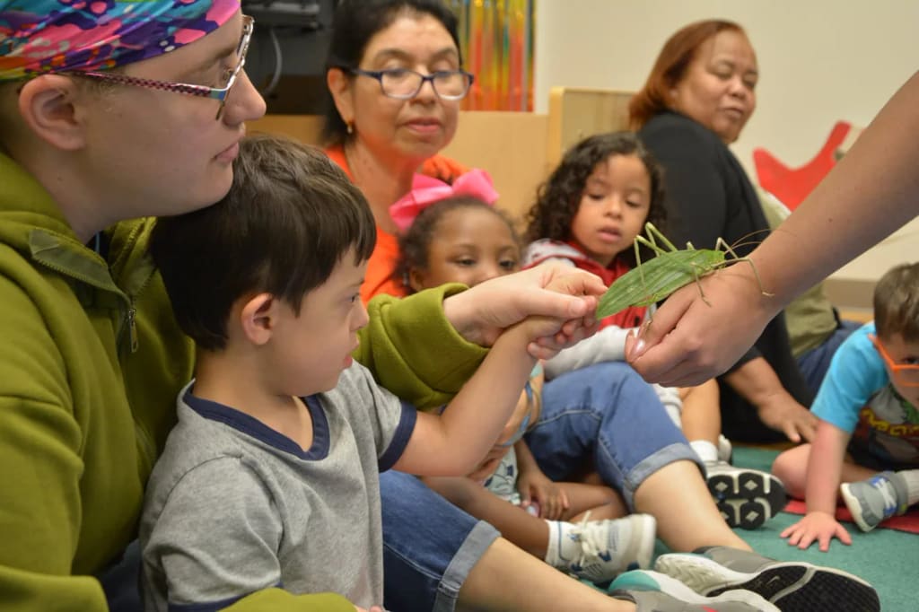 A student explores a hands-on nature lesson at Rise School of Houston