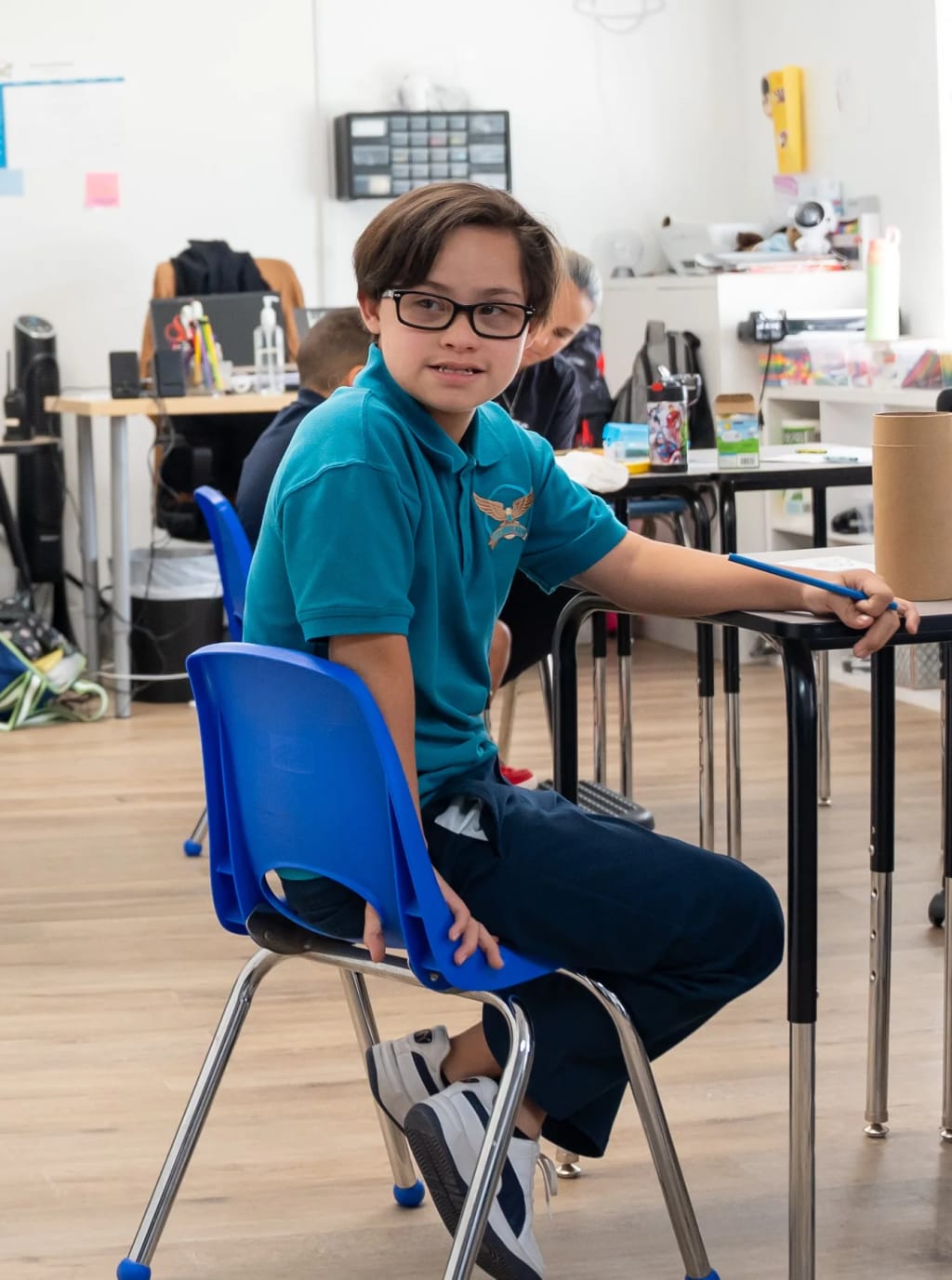 A Great Heights Academy student works independently at a classroom desk