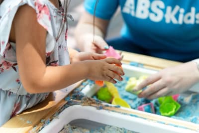 ABS Kids clinician and child working with a hands-on therapy activity