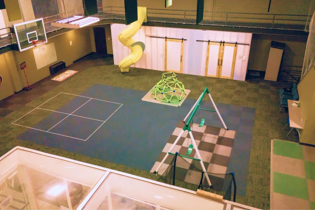 Large indoor play and movement area at Woven Care Central East