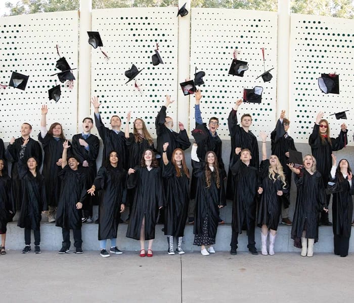 New Way Academy graduates toss their caps at commencement