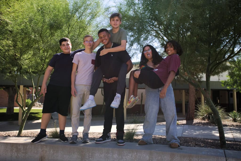 New Way Academy students gather outdoors on the Phoenix campus