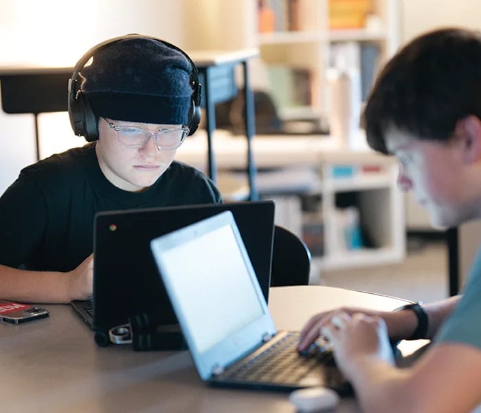 A New Way Academy student uses technology during a classroom lesson