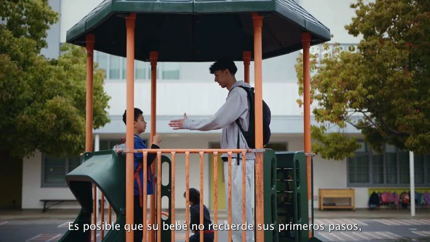 A New Open World Academy student works at an outdoor table on the Los Angeles campus