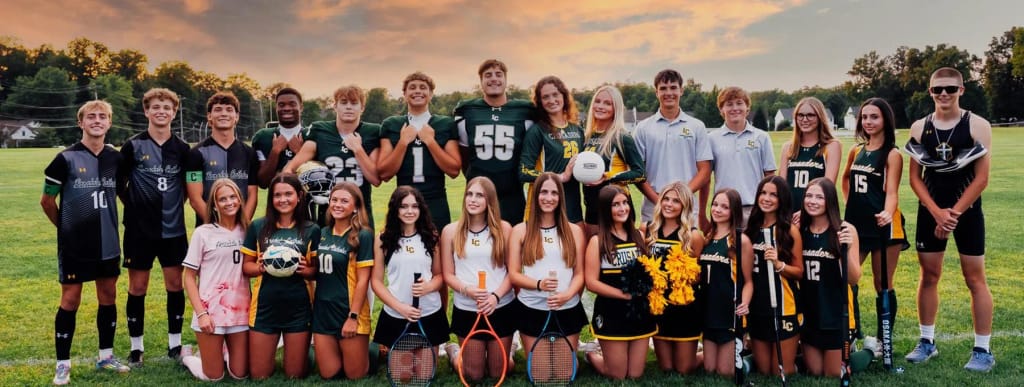 Lansdale Catholic student athletes and teammates gather outdoors after a school activity.