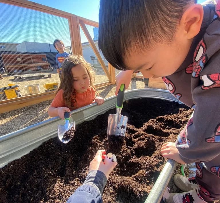 Lucciola Academy children gardening outdoors