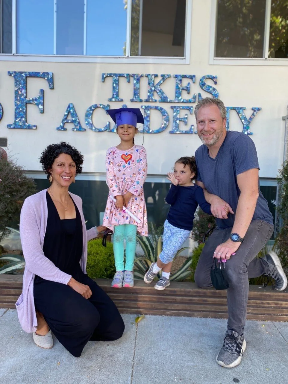 SF Tikes Academy students and staff at the school entrance