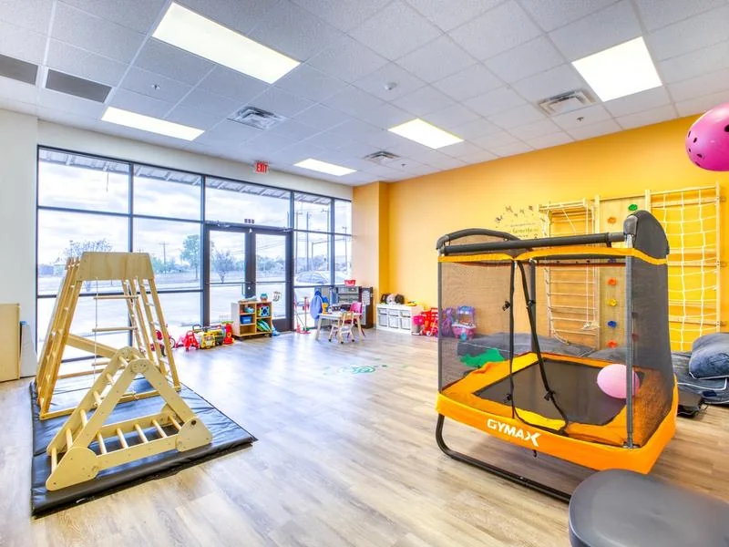 Indoor activity room with therapy equipment at Mindcolor Autism in San Antonio.