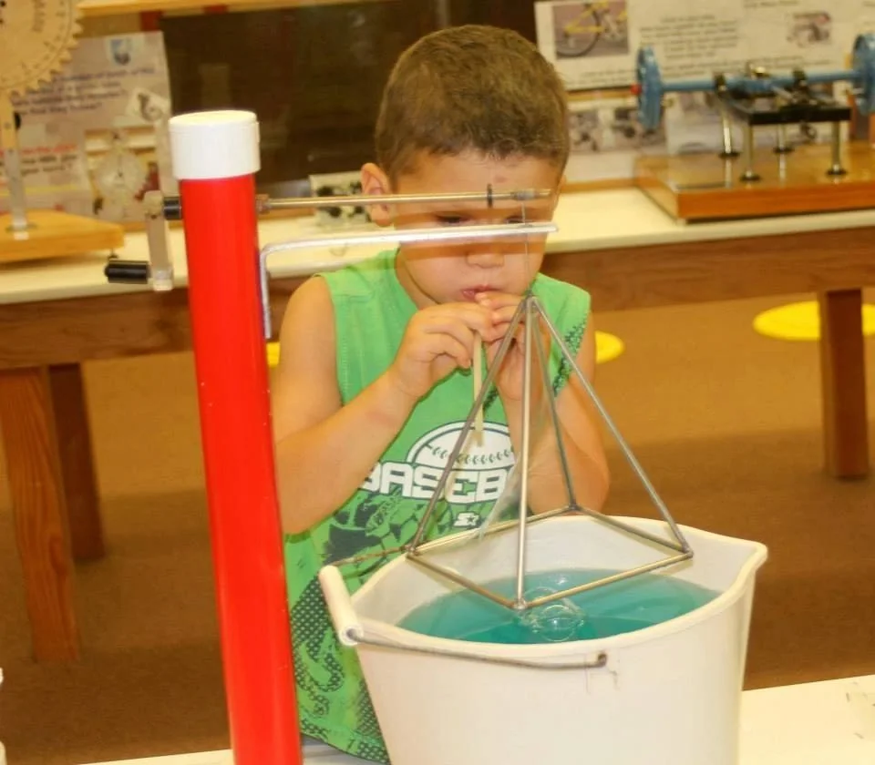 Child taking part in a hands-on science activity