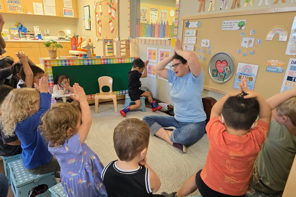Rise School of San Antonio teacher leading a classroom group