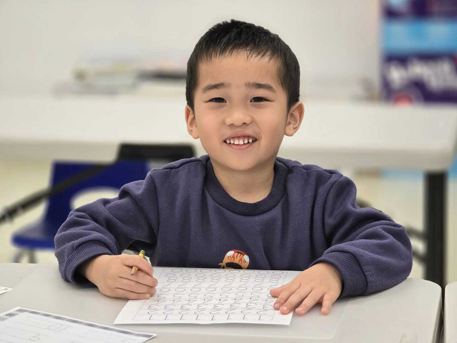 Glorious Academy student completing a classroom worksheet