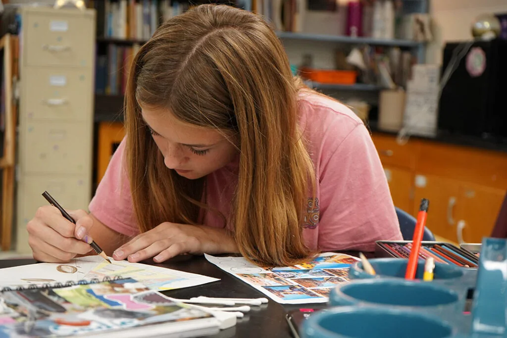 Dayspring Christian Academy student creating artwork