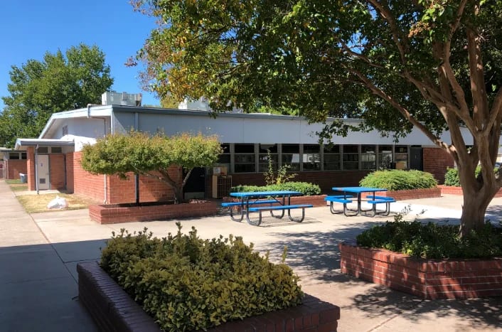Fairsite Preschool exterior shows the official school building and courtyard.