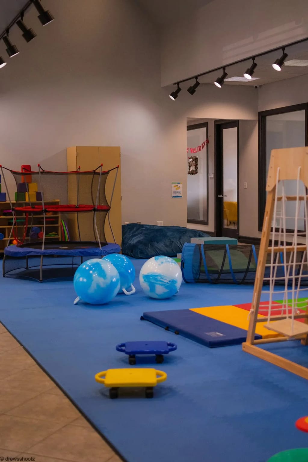 Indoor movement room with therapy equipment at Behavior Frontiers.