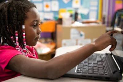 Carver Community School student using a classroom laptop