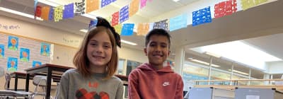 Joan Austin Elementary students showing classroom art at their school.