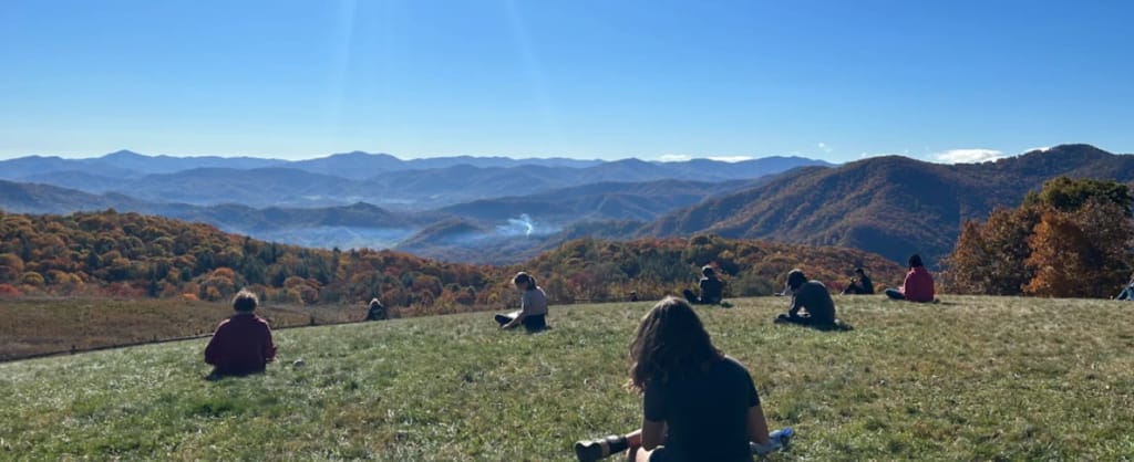 Evergreen Community Charter School students learning at a mountain overlook.