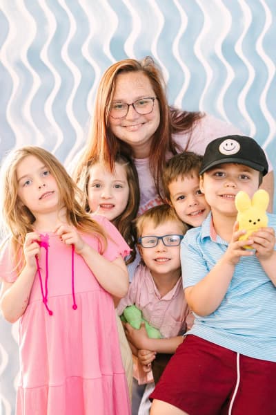 A teacher with students in the school community at Lighthouse School of Fort Worth