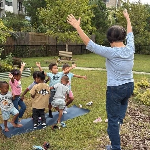 Students taking part in an outdoor movement activity at Heart of Hope Academy