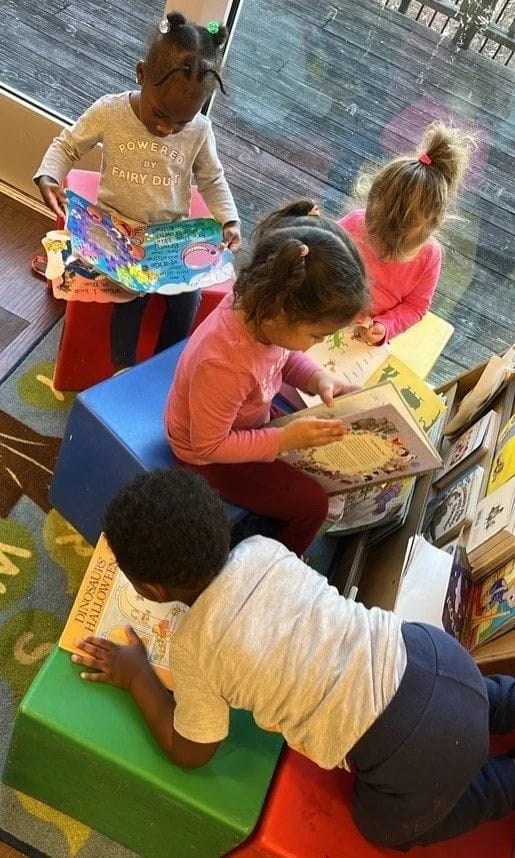 Children working together at a classroom table at Heart of Hope Academy