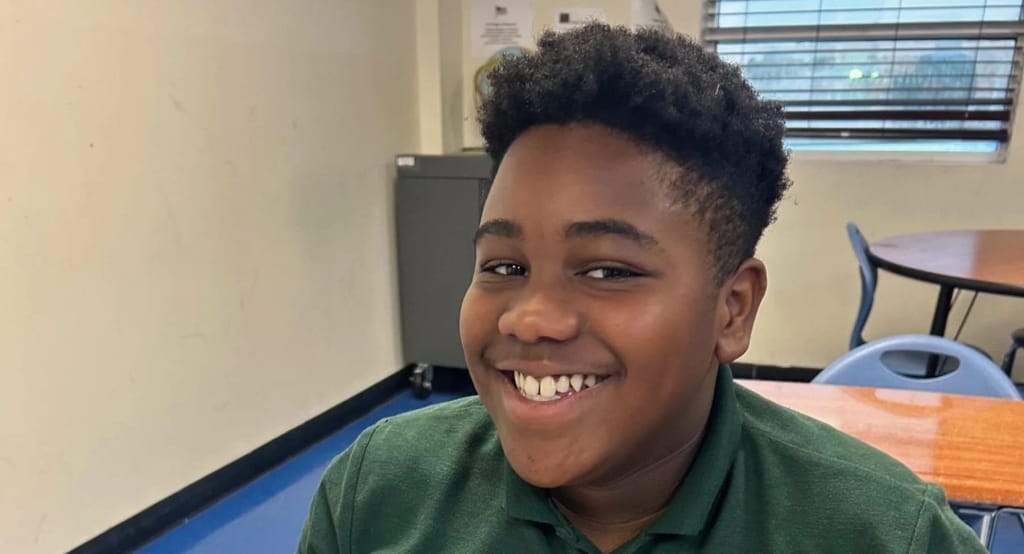 A Nova Charter School student smiles in a Dallas classroom