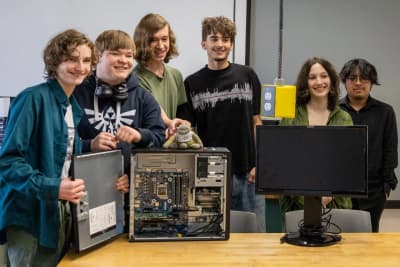 Center for Advanced Learning students working with computer equipment