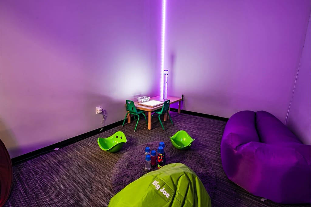 Indoor sensory room with soft seating and activity materials at Centria Autism.