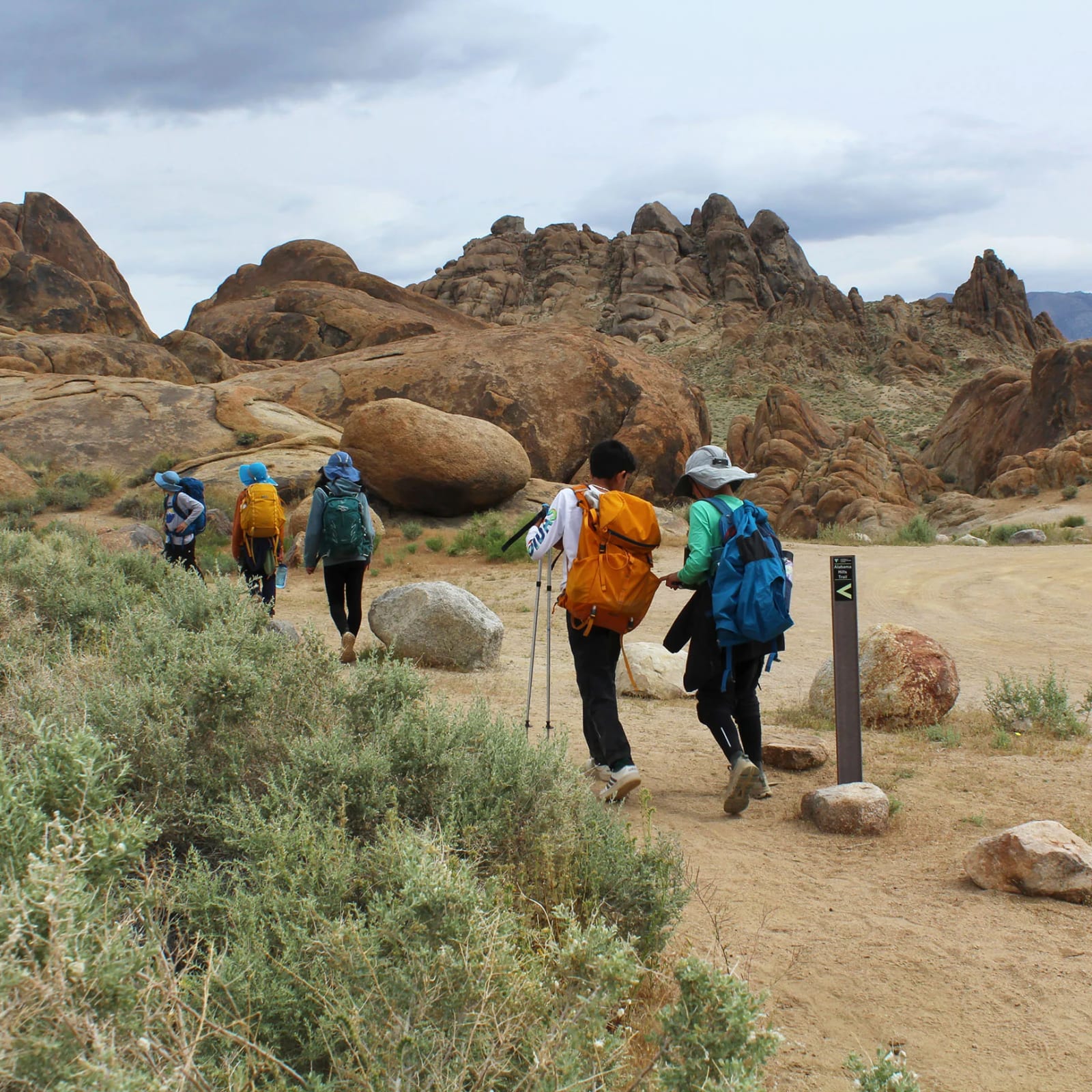 Odyssey School students hiking on a rocky outdoor expedition