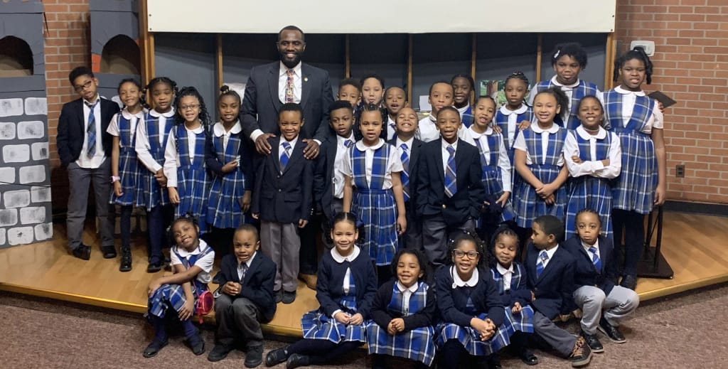 Children's Technological Academy students and staff in school uniforms