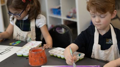 Winston School San Antonio students painting in class