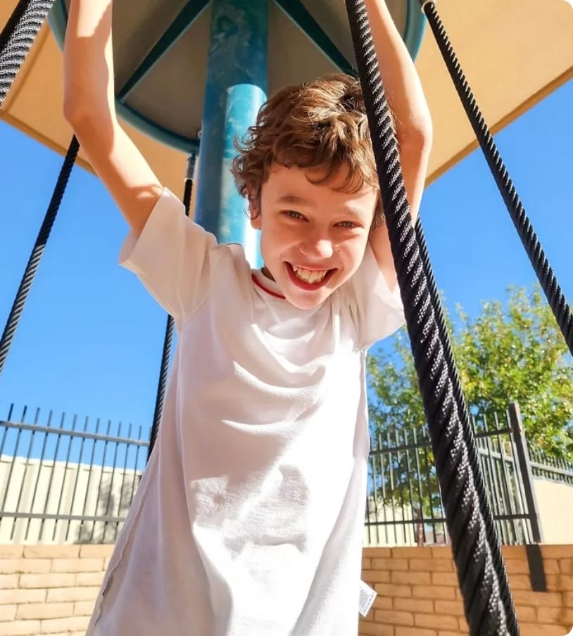 An ACCEL Phoenix student enjoys outdoor play on campus