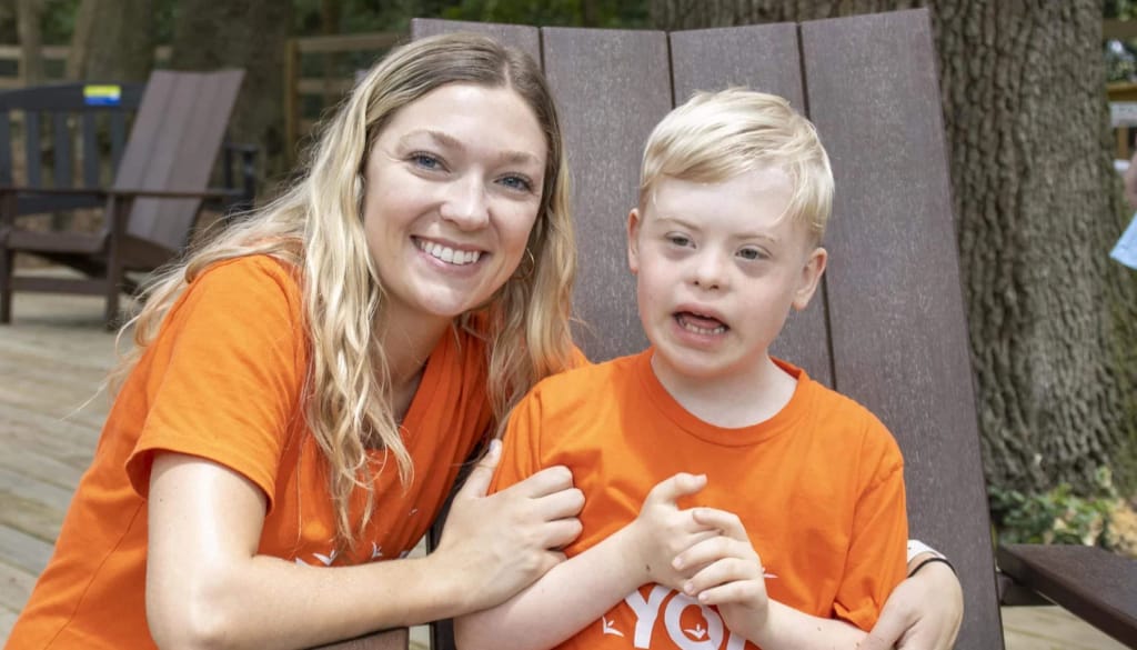 A North Florida School of Special Education student with a staff member outdoors in Jacksonville, Florida.
