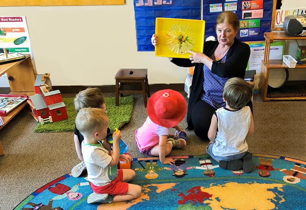Parker Montessori teacher reading to young children
