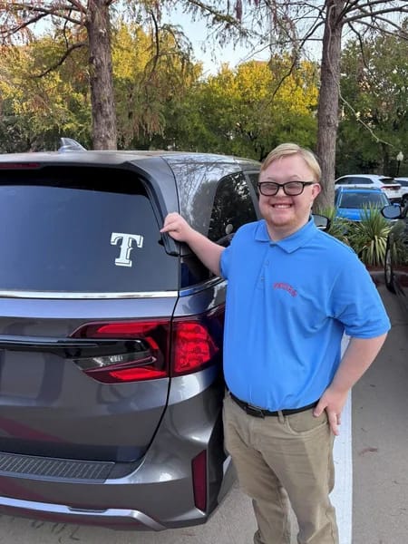 A Notre Dame School of Dallas student celebrates a community donation