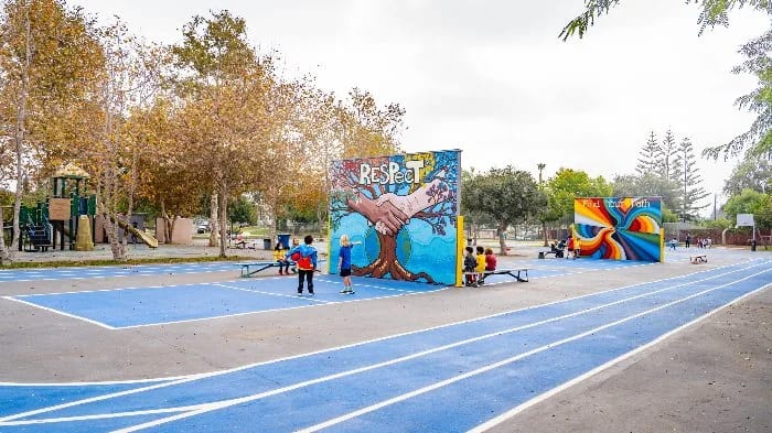 The playground and student mural at Open Magnet Charter School