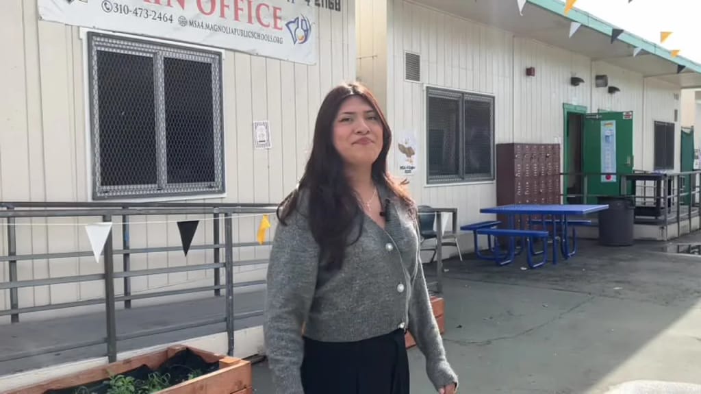 A Magnolia Science Academy 4 staff member stands outside the Los Angeles campus office
