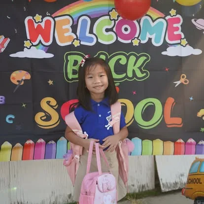 A Magnolia Science Academy 4 student celebrates the first day of school
