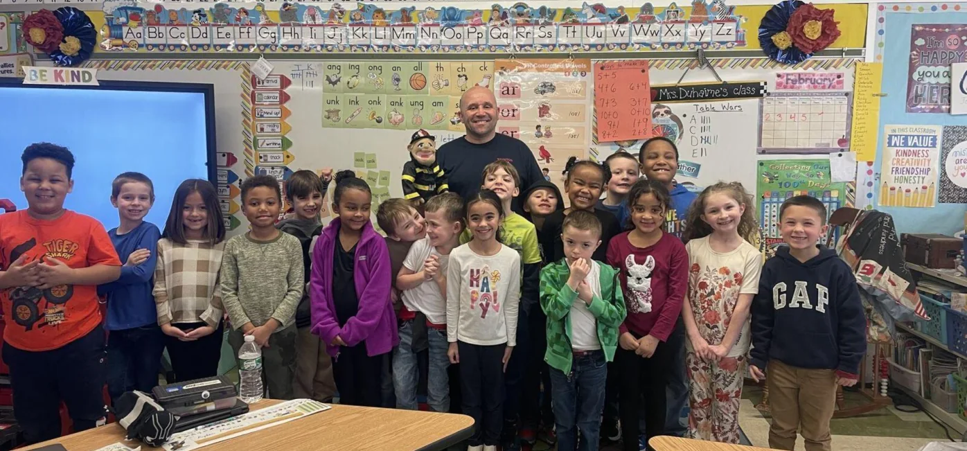 Edmund Hatch Bennett Elementary students pose together in their classroom.
