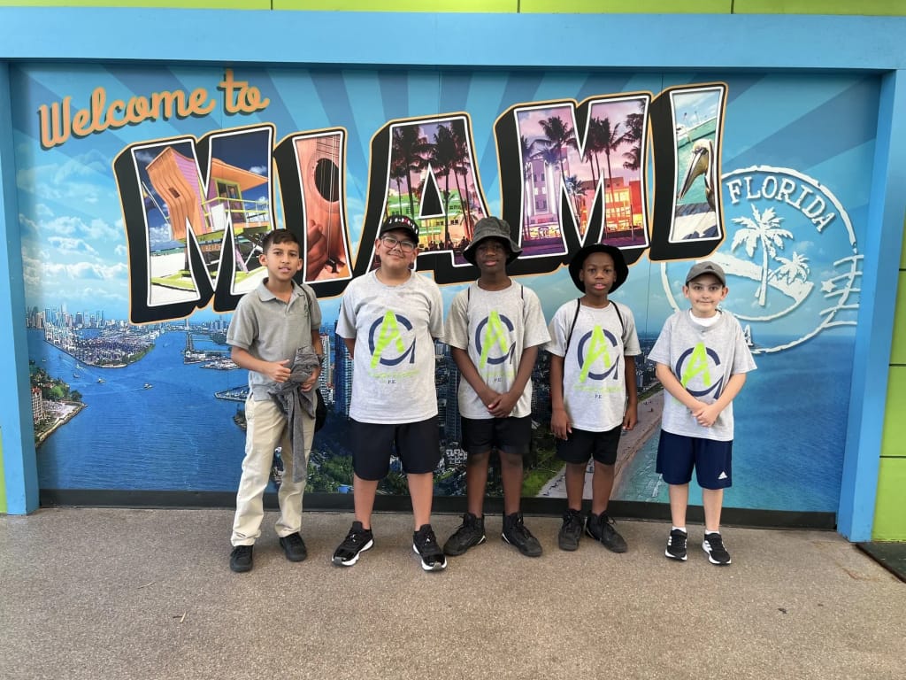 Avant Garde Academy in Hollywood: students standing beneath a school mural.