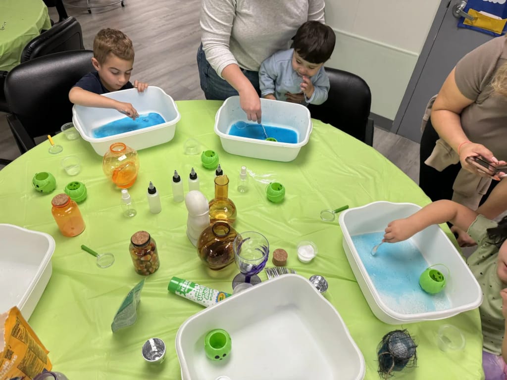 Happy Day Play children exploring sensory water bins