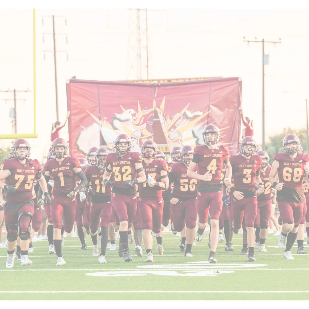 Valley Christian Schools - Cerritos, CA in Cerritos, CA: Valley Christian students running onto the football field.