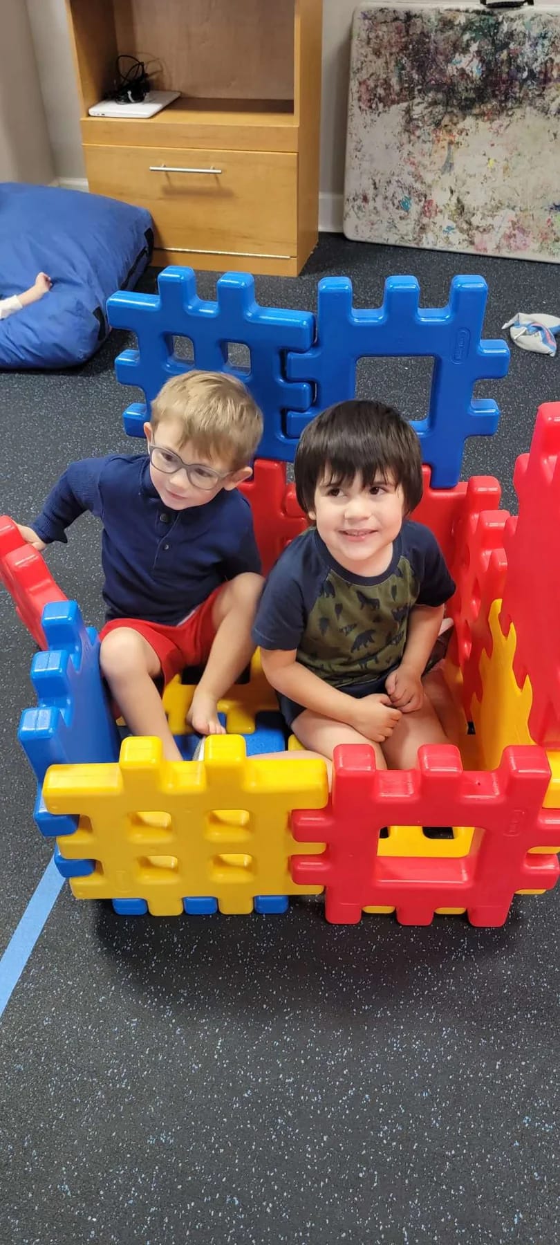 Children participating in an indoor play activity shared by Mindful Masterpieces.