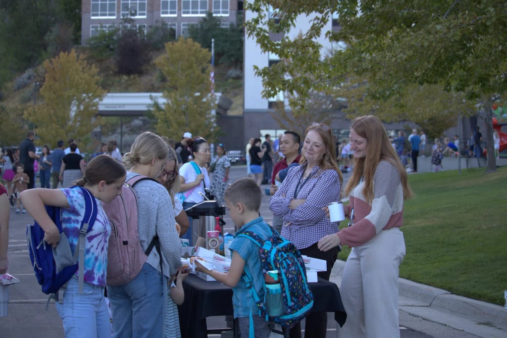 Intermountain Christian School students arriving at the tree-lined campus.