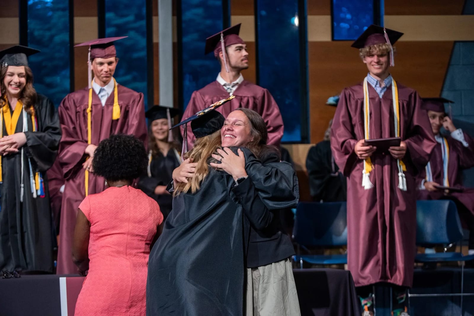 Intermountain Christian School graduates receiving congratulations during commencement.