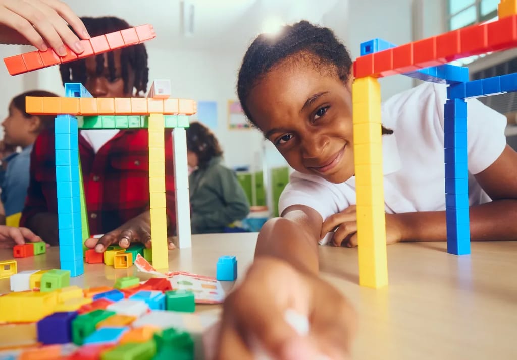 Primer Microschools student building with colorful materials