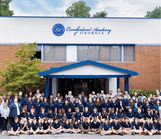 Students and staff in front of the school building at Cumberland Academy of Georgia