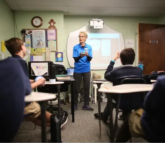 A teacher leading a classroom lesson at Cumberland Academy of Georgia